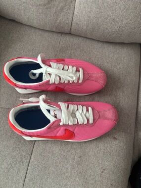 Nike Pink Sneakers with Red Swoosh and White Laces